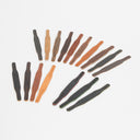 A set of leather strap or band pieces in multiple colors and textures, arranged in a loose circle on a light gray background.