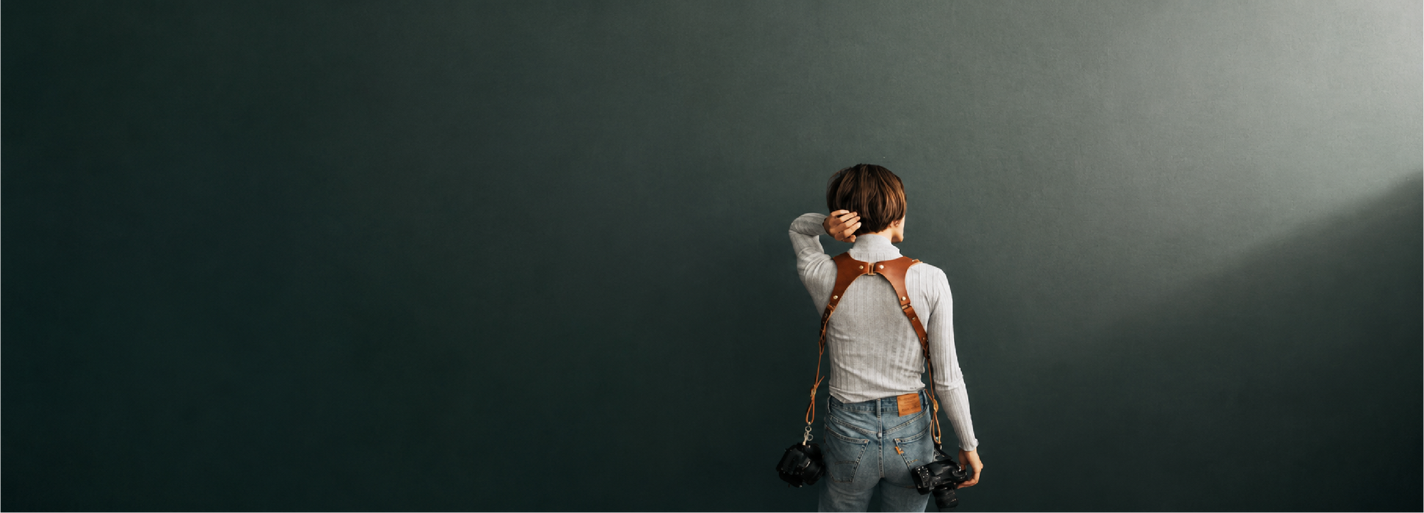 Photographer wearing the Lone Bandit camera harness